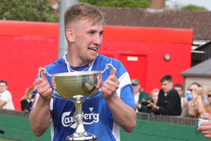 Sam Phillips lifts the St Mary's Cup in 2014